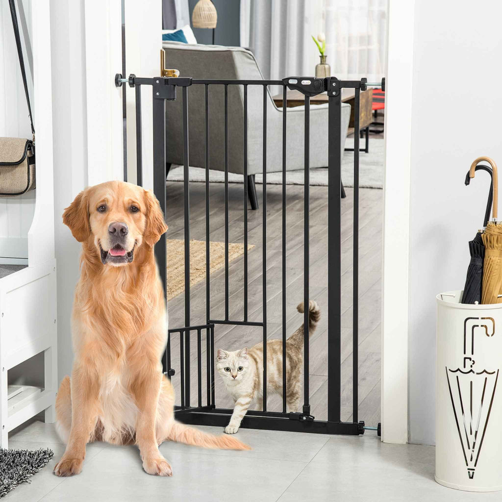 Large dog and cat sitting in front of black pet safety gate