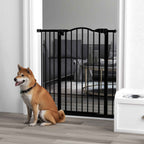 Medium sized dog sitting in front of black metal dog gate in living room