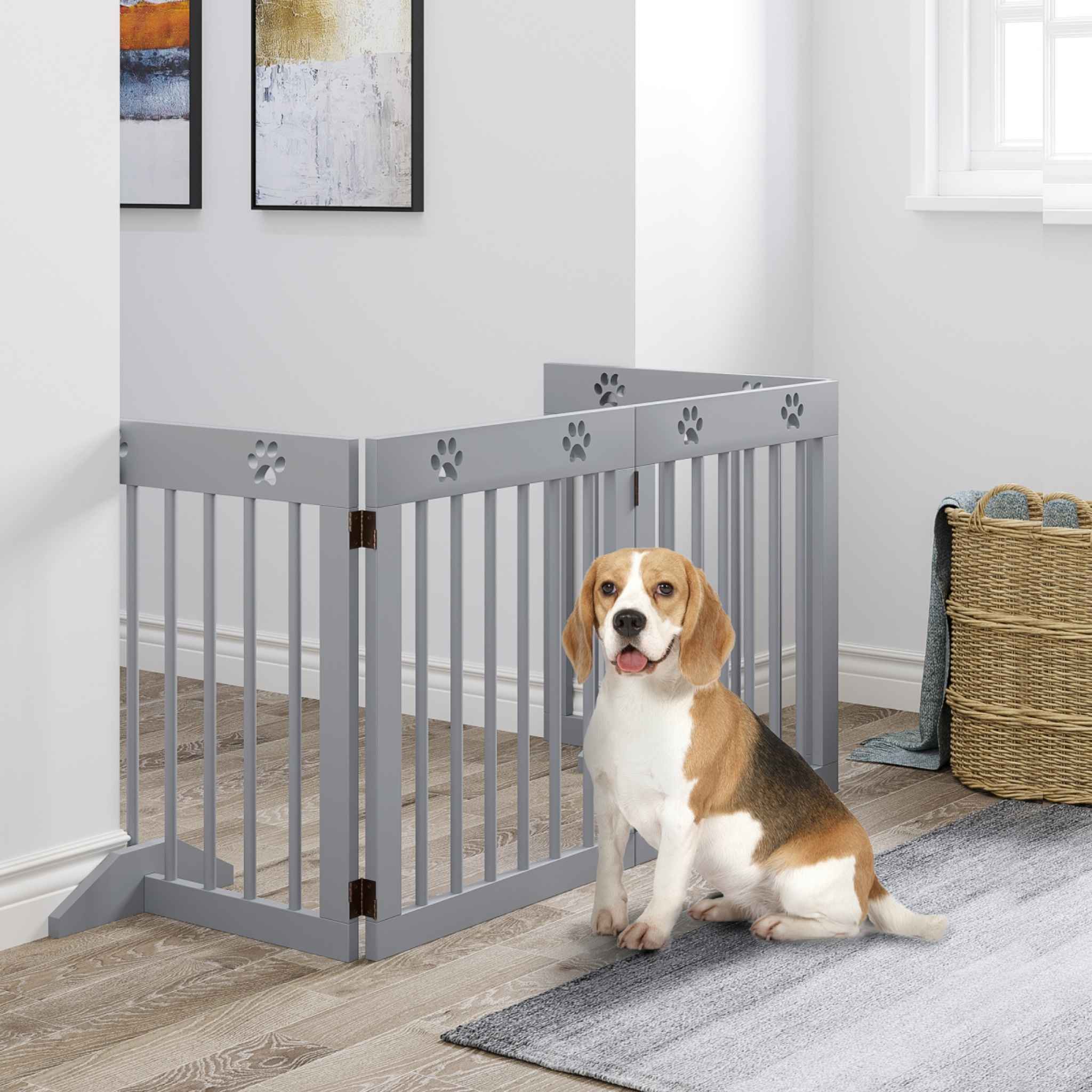 Medium sized dog sitting in front of grey safety gate in living room
