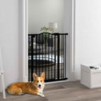 Medium sized dog sitting in front of tall black metal safety barrier in living room