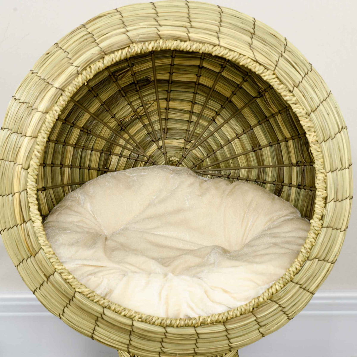 Plush cushion in raised feline bed