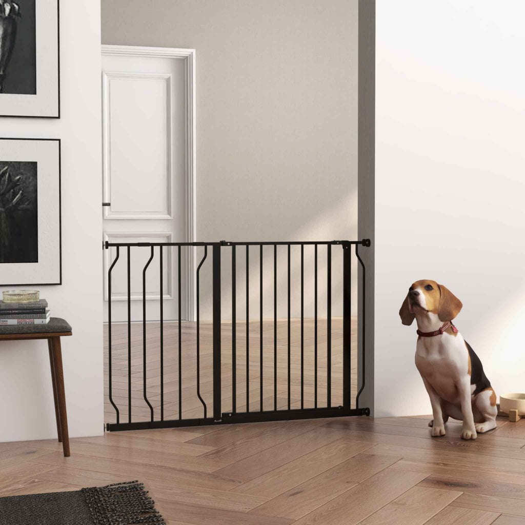 Pressure fit black dog gate in hallway