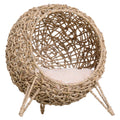 Raised beige wicker cat bed