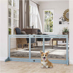 Small dog sitting in front of grey freestanding pet gate