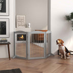 Small dog sitting in front of tall grey dog gate
