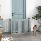 Small dog standing in front of freestanding pet gate in doorway
