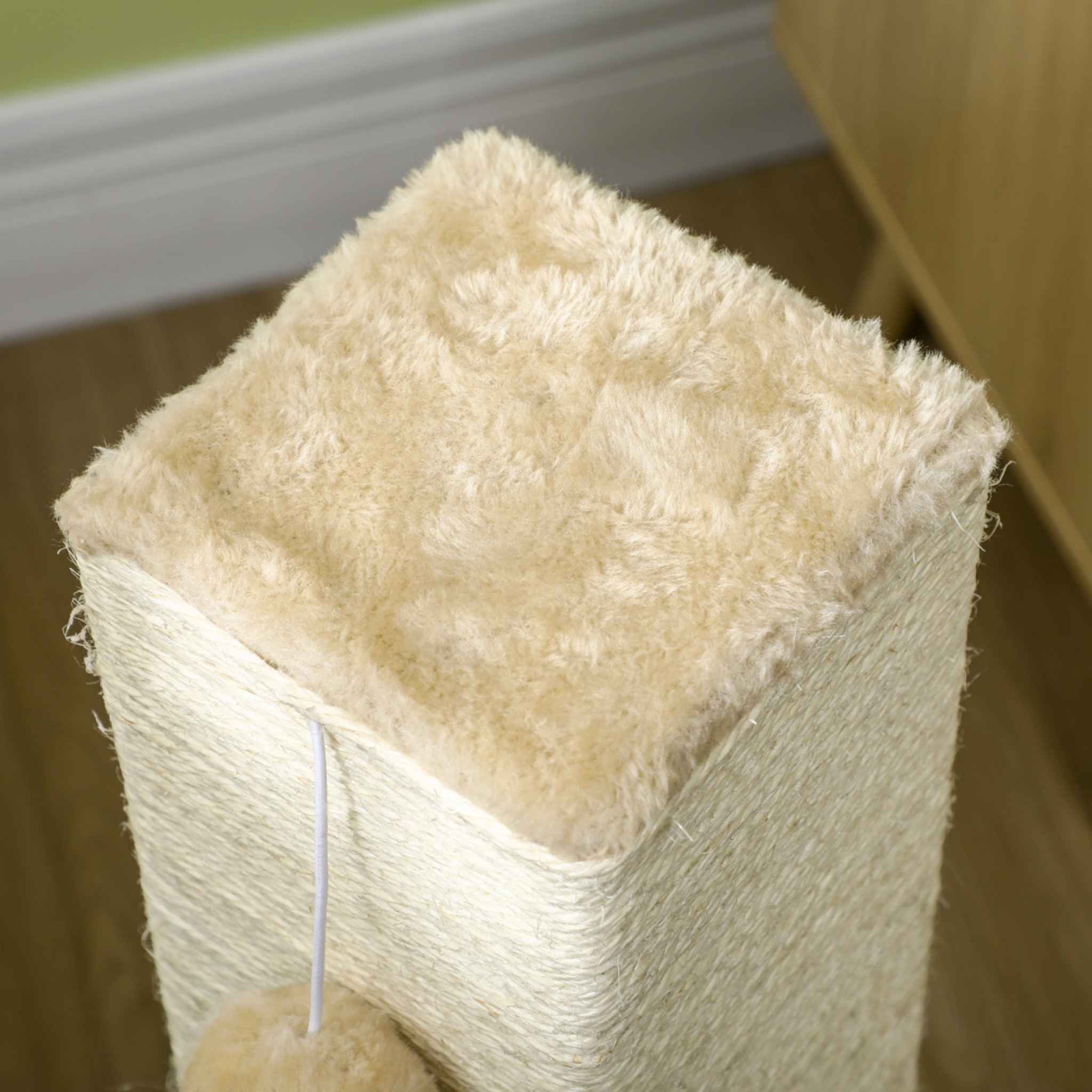 Soft plush beige perch at top of scratching post
