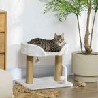 Tabby cat sitting on white cat tree
