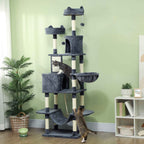 Two cats climbing on dark grey cat tree