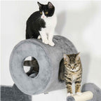A grey plush cat house with two cats