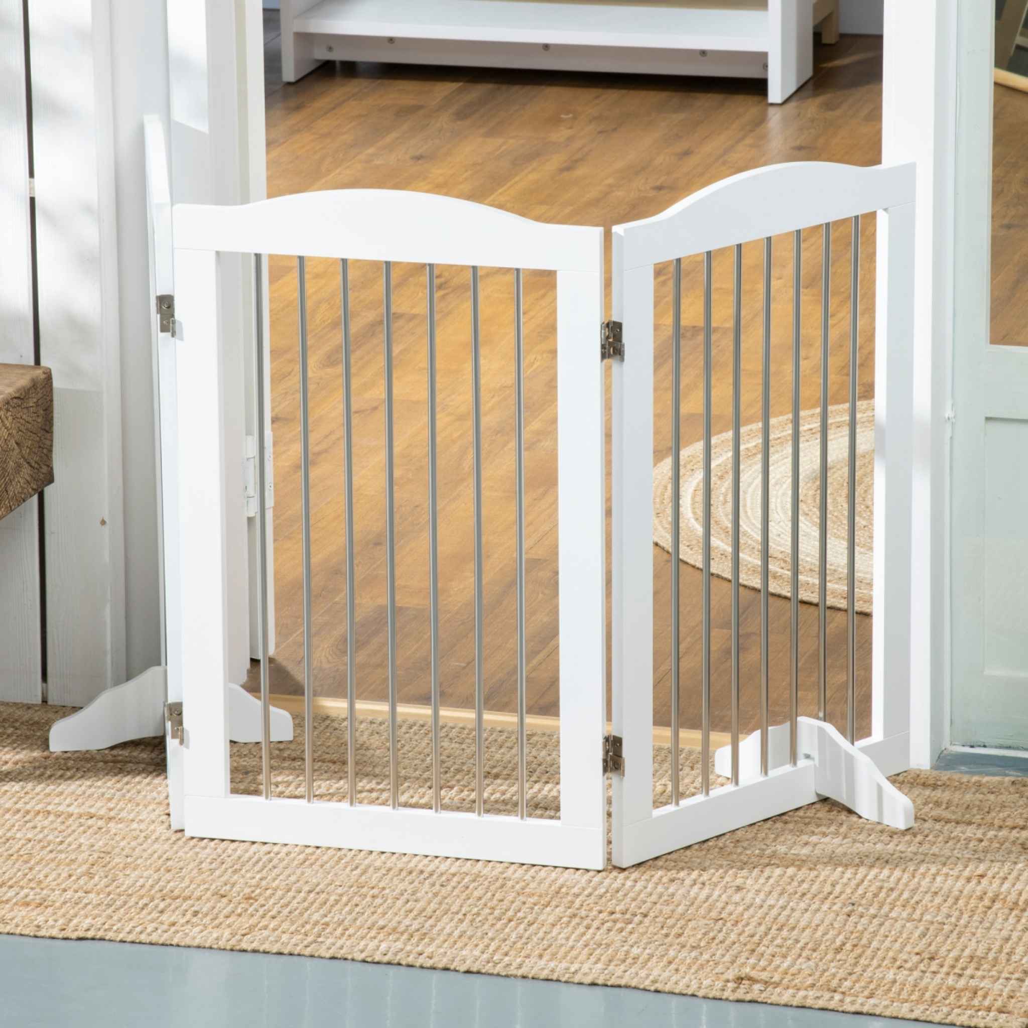 White freestanding pet gate in hallway