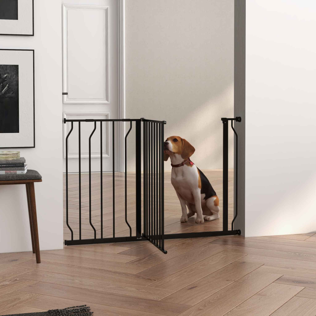 Wide black metal pet gate in hallway