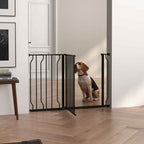 Wide black metal pet gate in hallway